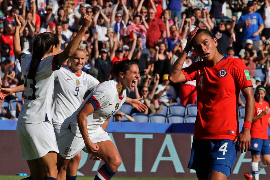 United States' Carli Lloyd, center, celebrates with teammates after scoring their side's third goal during the Women's World Cup match between United States and Chile.