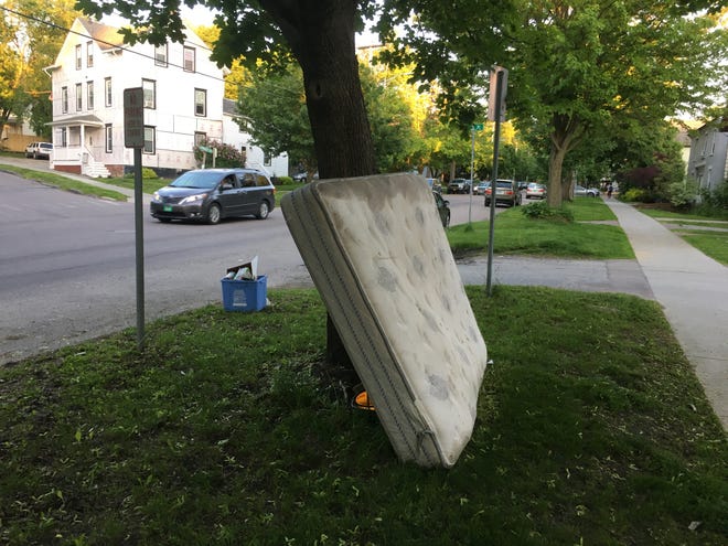 A discarded mattress is up for grabs (or disposal) on St. Paul Street in Burlington on June 7, 2019.