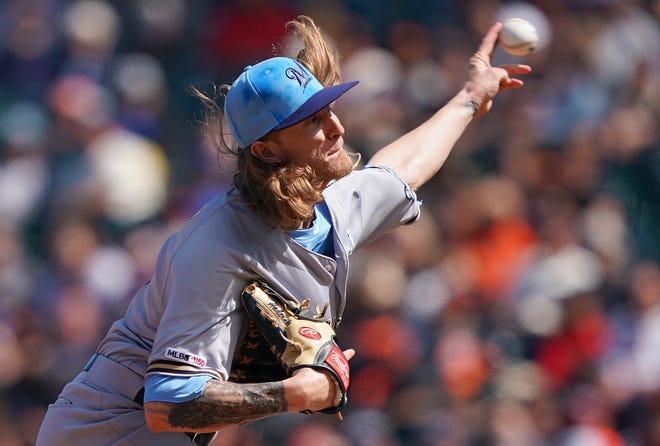 Josh Hader capped a strong day from the Brewers' bullpen by retiring all six Giants he faced -- three via the strikeout route -- in picking up his 17th save of the season.