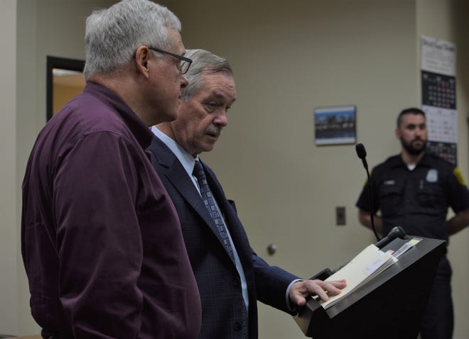 To the far left, former Westland priest Patrick Casey recently appeared in 18th District Court with his attorney because of a felony criminal sexual conduct charge.