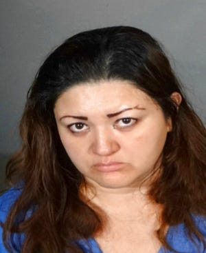 This undated booking photo provided by the Los Angeles Police Department shows Veronica Aguilar.  A preliminary hearing is underway this week of June 17, 2019,  in the case of Aguilar, a Los Angeles mother accused of keeping her special-needs son locked in a closet, ultimately causing his death.