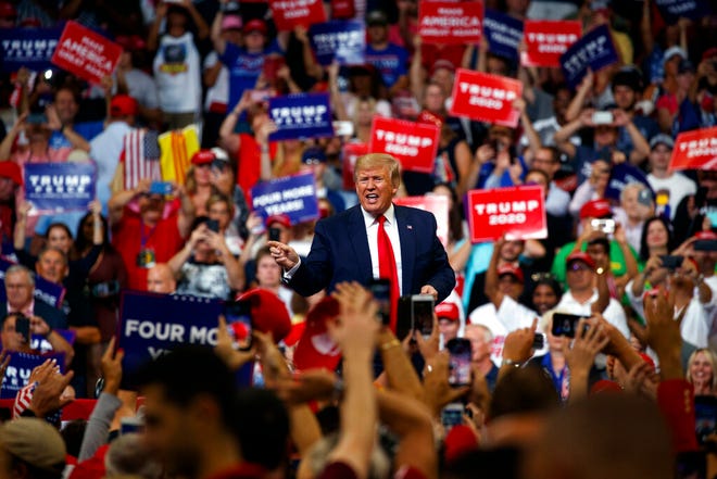 President Donald Trump reacts to the crowd after speaking at his re-election kickoff rally at the Amway Center, Tuesday, June 18, 2019, in Orlando, Fla.
