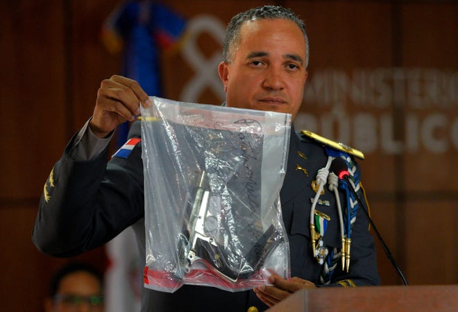 The director of the National Police, General Ney Aldrin Bautista Almonte shows the weapon that was used to shoot former Boston Red Sox slugger David Ortiz, during a news conference at the Attorney General's Office in Santo Domingo, Dominican Republic, last week. Six suspects, including the alleged gunman, have been detained in the shooting, the Dominican Republic's chief prosecutor said.