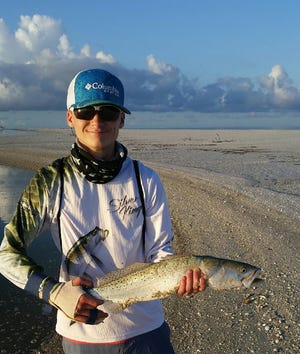 Jordan Windle with a big Trout he caught on Tigertail Beach, Marco Island. 