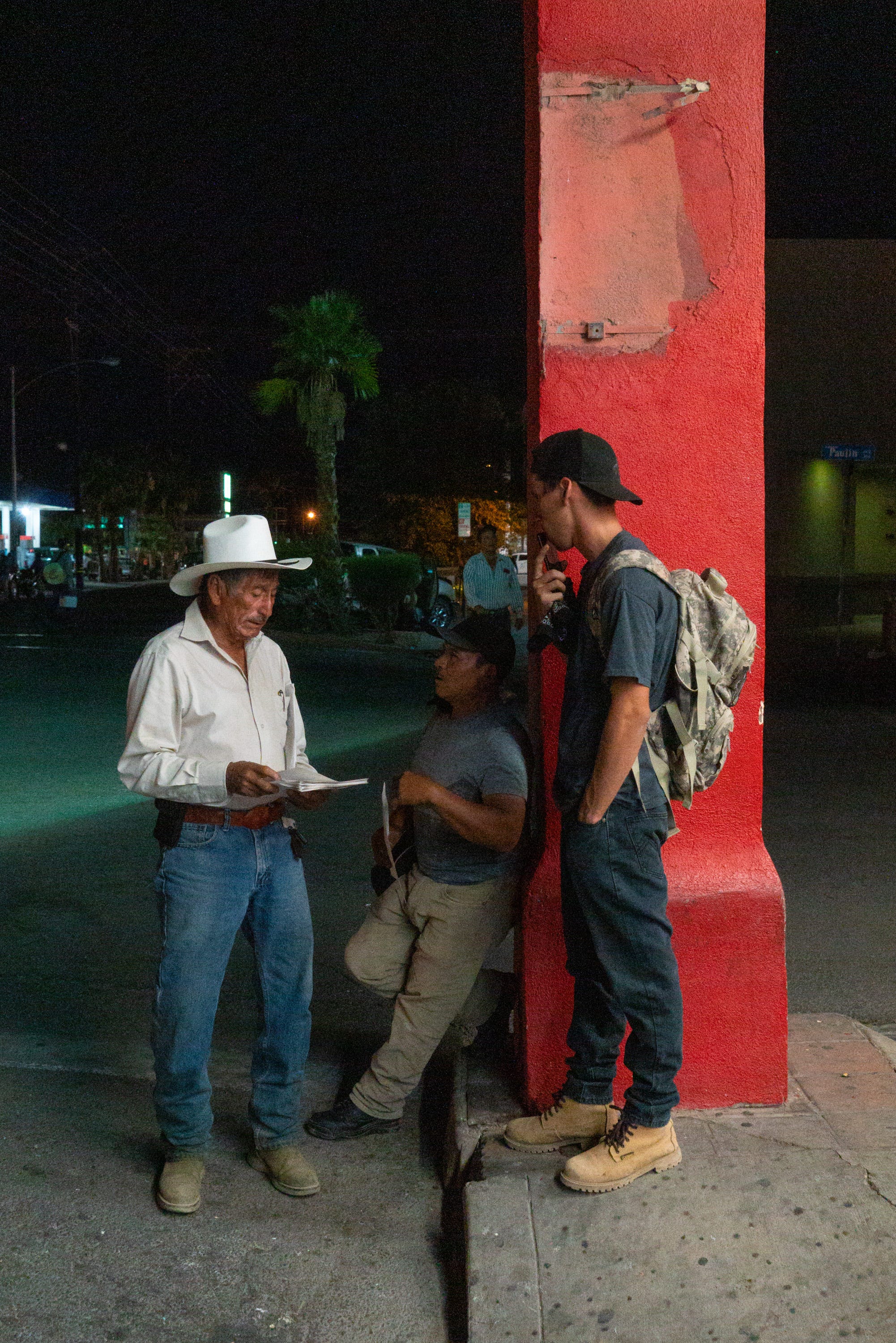 Mayordomo Francisco Moreno, known as "El Profe" recruits workers at Donut Avenue, Calexico, Calif., 3:02 AM, June 12, 2019.