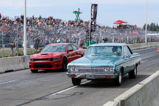 Amateur drag racers compete on a closed section of Woodward Avenue near the M1 Concourse in Pontiac during Roadkill Nights Powered by Dodge in 2018. The popular event returns to Pontiac this year.