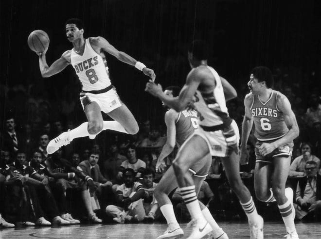 1977 first-round pick: Marques Johnson from UCLA.  Johnson, fast and flashy, steals the ball and fires a long pass to start a fast break in a 1981 playoff game against Philadelphia at the Arena.