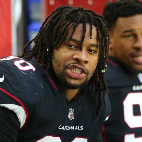 Robert Nkemdiche sits on the sidelines during a...
