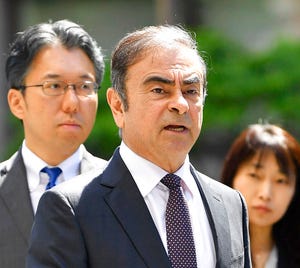 Former Nissan chairman Carlos Ghosn, center.