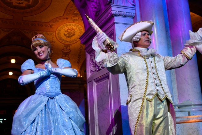 Costumed Cinderella and Majordomo appear before guests at an event marking the inclusion of Disney's "Cinderella" into the National Film Registry on its 70th anniversary, Thursday night at the Library of Congress in Washington.