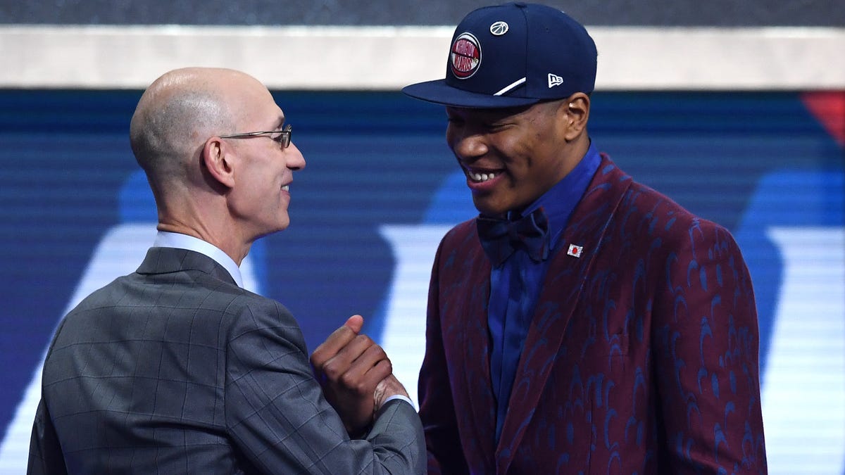 Rui Hachimura poses with NBA commissioner Adam Silver after being taken ninth overall by the Washington Wizards.