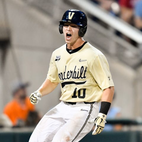 Vanderbilt shortstop Ethan Paul (10) scores on an...