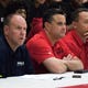 Northern Arizona assistant coach Shane Burcar and Arizona head coach Sean Miller and others watch the Millennium-Mater Dei game during the Section 7 Basketball tournament at Brophy Prep High School in Phoenix, Friday, June 21, 2019.  