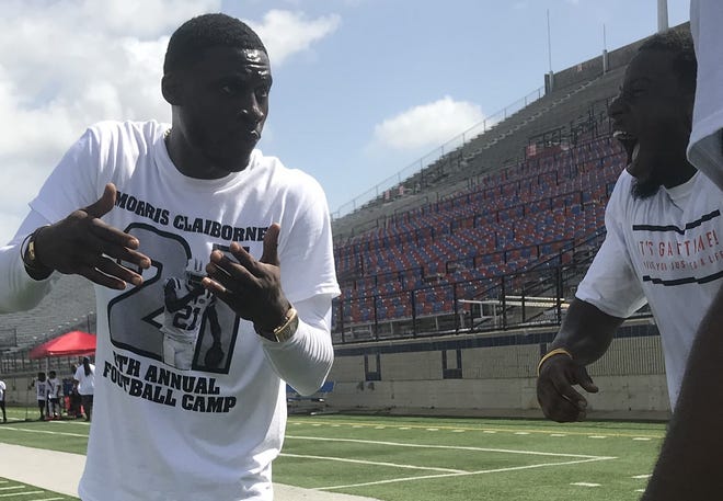 Former LSU standout Morris Claiborne earns a laugh at his Saturday camp.