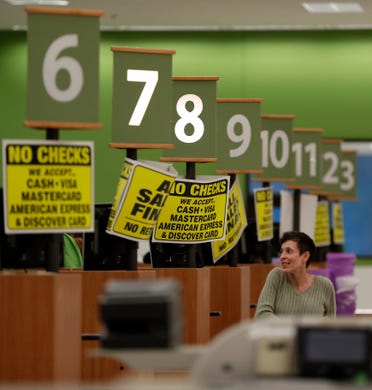 The final two check-outs remain open for the last few customers buying items at the Shopko in East Town Mall in Green Bay.