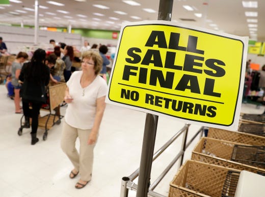 Shopko customers look for last-minute deals in the nearly empty Mason Street store on the last day of business June 23, 2019 in Green Bay, Wis.