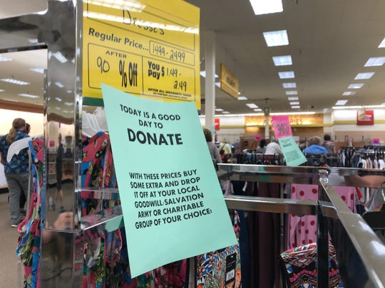 Signs encouraged shoppers in Wisconsin Rapids to buy extra items and donate them to charity.