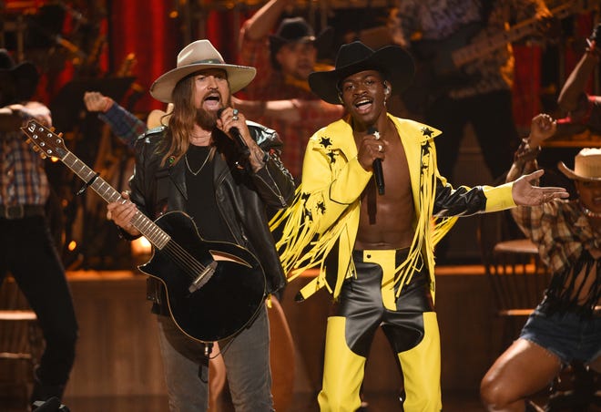 Billy Ray Cyrus, left, and Lil Nas X perform "Old Town Road" at the BET Awards on Sunday, June 23, 2019, at the Microsoft Theater in Los Angeles.