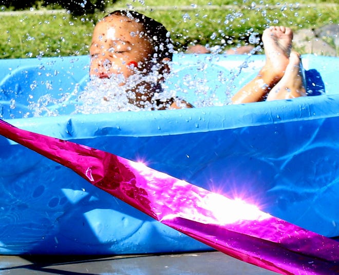 A kiddie pool can provide temporary relief from the summer heat in Deming, NM.