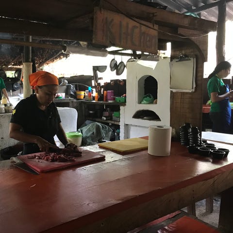 Women cooking for tourists near Puerto Vallarta,...