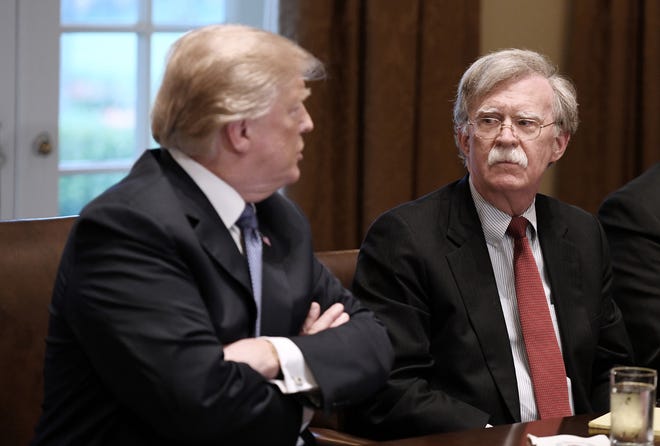 U.S President Donald Trump, left, and John Bolton, right, the new national security adviser attend a briefing from Senior Military Leadership in the Cabinet Room of the White House on April 9, 2018 in Washington, D.C. (Olivier Douliery/Abaca Press/TNS)