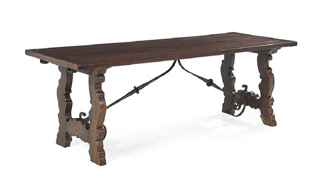Look for unusual styles of furniture to get a bargain. The heavy, old timbers and craftsmanship of an antique is why it is still in good condition and can take hard use. This table is in the Elizabethan style, 400 years old, and still going strong.
