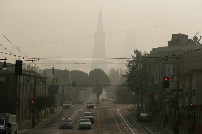 The Transamerica Pyramid is obscured by smoke and haze from wildfires in San Francisco. Tens of millions of people in the Western U.S. face a growing health risk due to wildfires as more intense and frequent blazes churn out greater volumes of lung-damaging smoke.