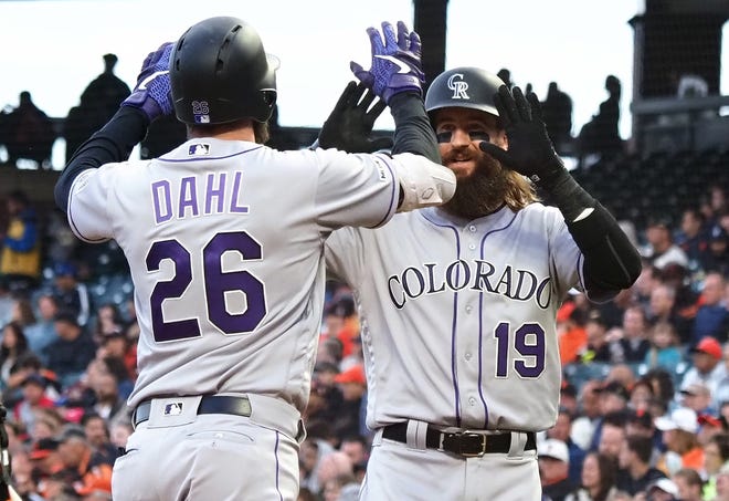 Colorado Rockies outfielders David Dahl and Charlie Blackmon exchange high-fives after Dahl's two-run homer Monday night in a 2-0 win at San Francisco. The Rockies wrap up a nine-game West Coast road swing with a 1:45 p.m. game Wednesday in San Francisco.