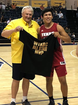 Irion County's Nathan Chacon, right, is awarded the most valuable player award for the West Texas Basketball Coaches Association small-school boys all-star game Sunday, June 23, 2019, at Angelo State University's Junell Center. Also pictured is event sponsor Skip Priess.