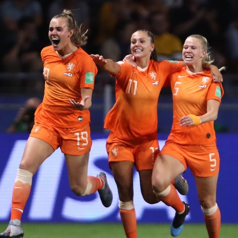 Dutch players celebrate after scoring the...