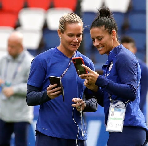 Ashlyn Harris, left, and Ali Krieger chat during...