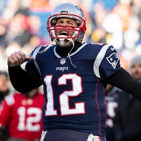 Tom Brady reacts during warmups before the...