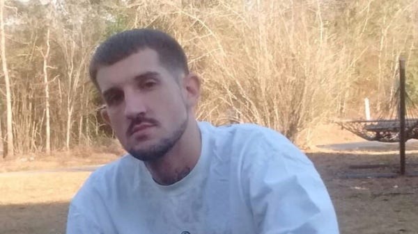 Brad Fitch, here in 2016, was stabbed to death by...