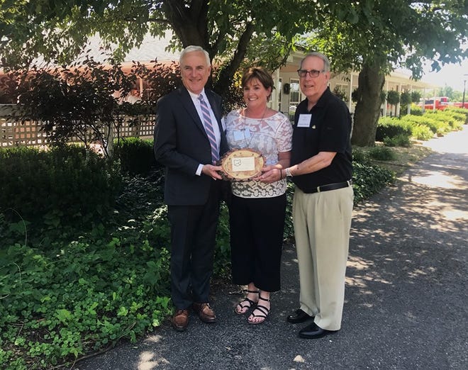 Adena CEO Jeff Graham, Downtown Chillicothe Director Tiffany Baldwin and Downtown Chillicothe board member Jim Doersam were honored with the best downtown revitalization efforts award for their work in Chillicothe, Ohio.