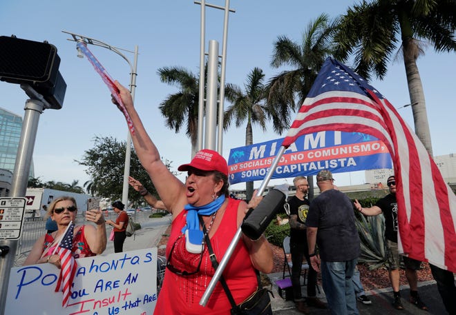 Roxanna Greene, a supporter of President Donald Trump, protests outside of the Knight Concert Hall.