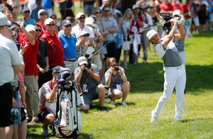 Rickie Fowler hits his second shot on the 18th hole during pro-am of the Rocket Mortgage Classic on Wednesday.