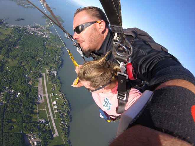 Tandem jump instructor JR Piosek and Elizabeth McCann enjoy an aerial view of South Bass Island during a jump with Skydive Put-in-Bay.
