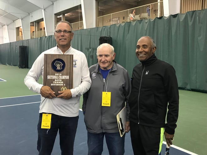 Green Bay Southwest tennis coach Randy Nelson, left, poses with assistant coaches Bill Simon, center, and Windsor Tanner.