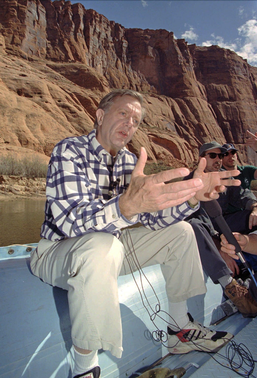 Bruce Babbitt, then the U.S. Interior Secretary, talks about the Colorado River and the Grand Canyon as he takes a raft trip down the river from Page on March 25, 1996. He opened the gates at Glen Canyon Dam to start the first controlled flood of the Colorado River.