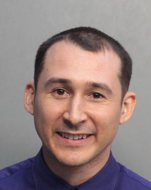 Austin Ogg, 30, was arrested by the Miami-Dade Police Department on Wednesday after intruding on candidates ahead of democratic debate in Miami.