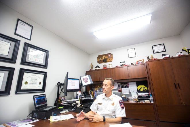 North Liberty Fire Chief Brian Platz, shown at his desk in 2019, is looking forward to bringing in three additional firefighters to help his force meet the needs of the growing city.