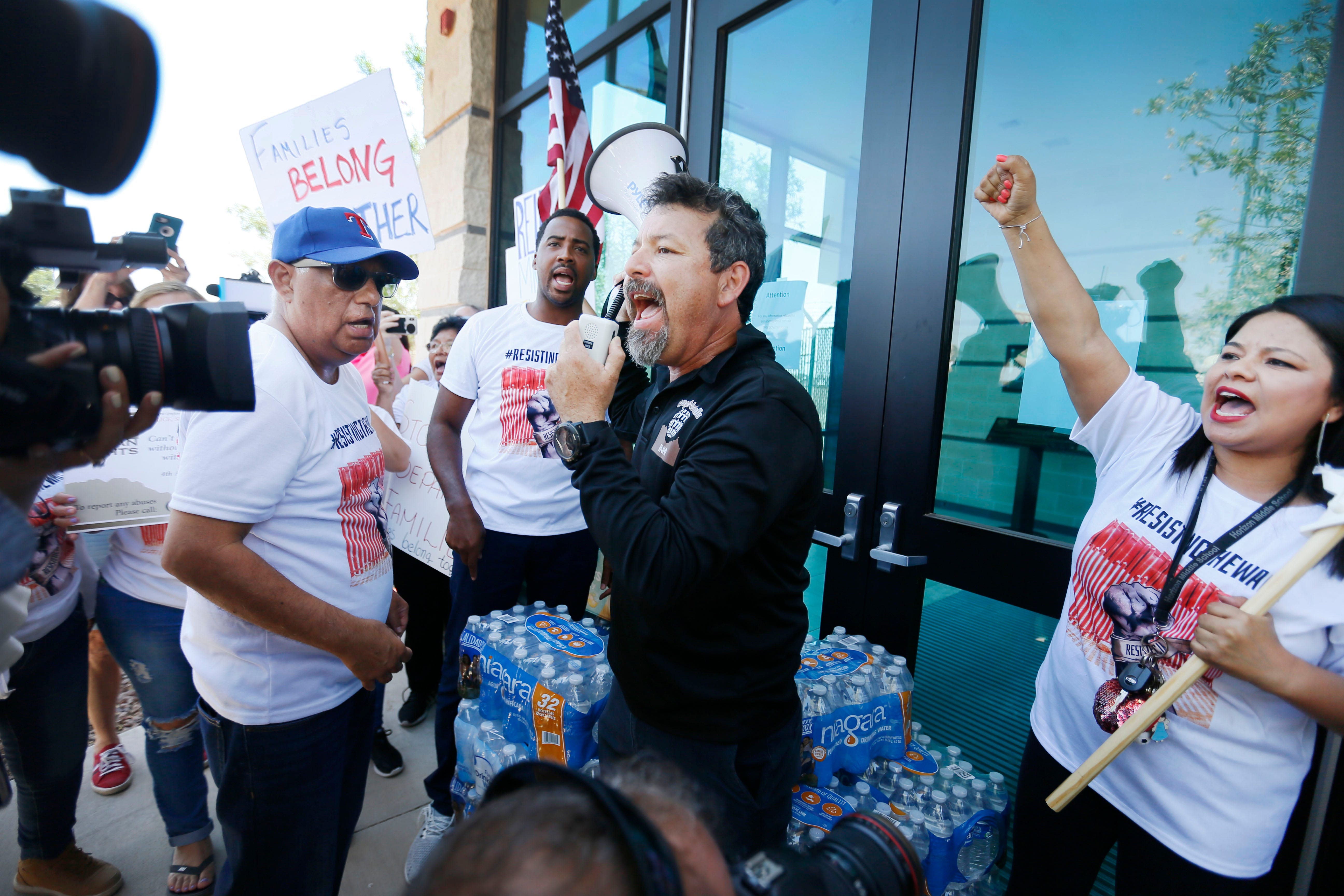 Fernando Garcia, BNHR executive director, says some words of encouragement to the protesters at the doors of the Border Patrol station in Clint, Texas, Thursday, June 27. The protesters gathered at the doors in opposition of the alleged mistreatment of the migrant children at the station. The Border Network for Human Rights organized the protest. A group from California, CaravanToClint, also joined BNHR outside of the station.