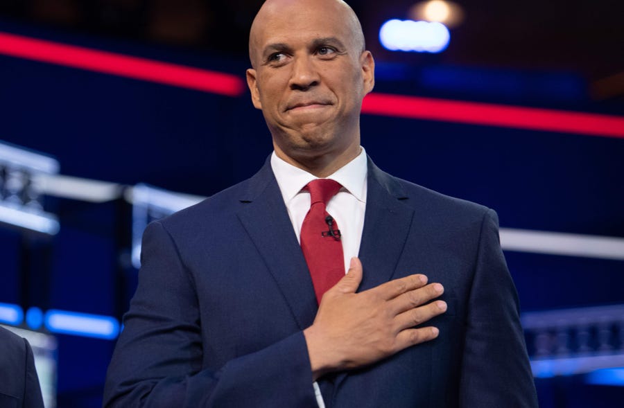 Sen. Cory Booker, D-N.J, gestures as he arrives to participate in the first Democratic  debate in Miami on June 26, 2019.