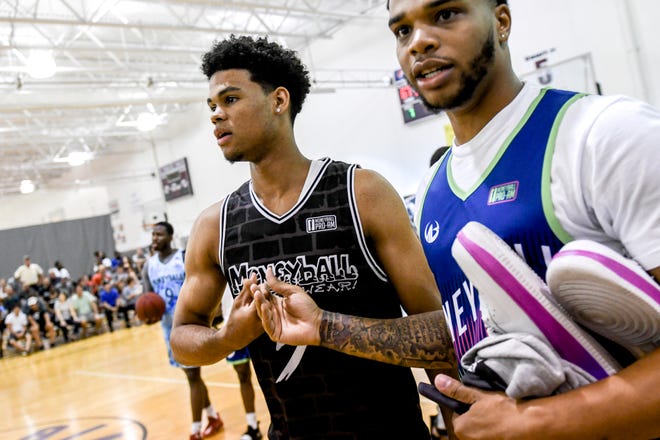 Michigan State freshman Malik Hall, left, shakes hands with former Spartan Miles Bridges before their Moneyball Pro-Am game on Thursday, June 27, 2019, at Aim High Sports in Dimondale.