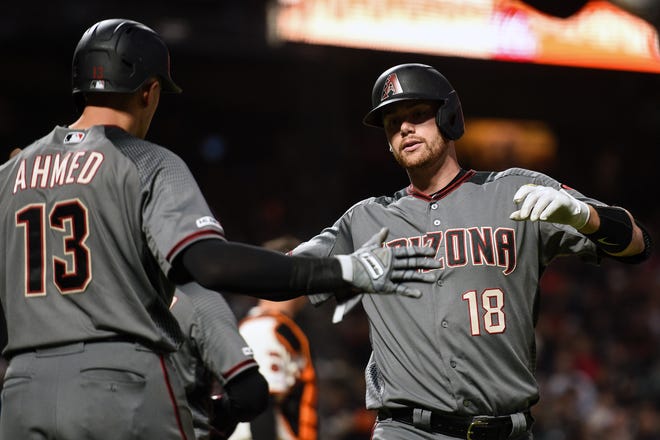 Jun 27, 2019; San Francisco, CA, USA; Arizona Diamondbacks catcher Carson Kelly (18) celebrates with shortstop Nick Ahmed (13) after hitting a two-run home run against the San Francisco Giants in the seventh inning at Oracle Park. Mandatory Credit: Cody Glenn-USA TODAY Sports