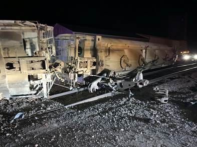 About four empty rail cars piled up along South A Avenue in New Underwood in front of the grain elevator, according to authorities.