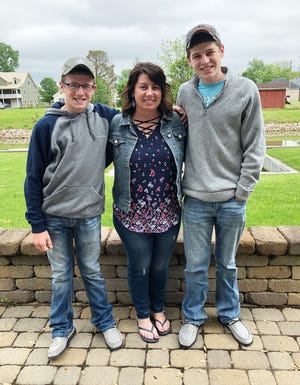Tristin (right) with his mother Jessica and little brother Chase on Mother's Day.