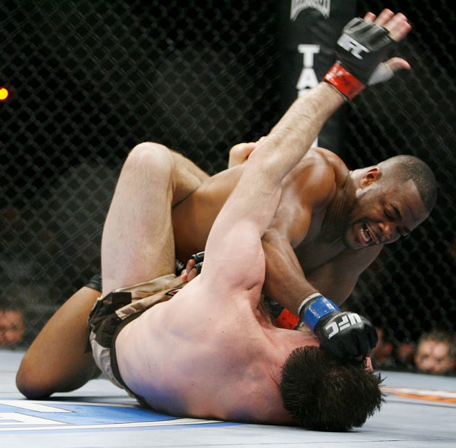Rashad Evans connects with a right to Forrest Griffin during the third round of their UFC light heavyweight mixed martial art match Saturday, Dec. 27, 2008 at The MGM Grand Garden Arena in Las Vegas. Evans won in the third round by TKO.