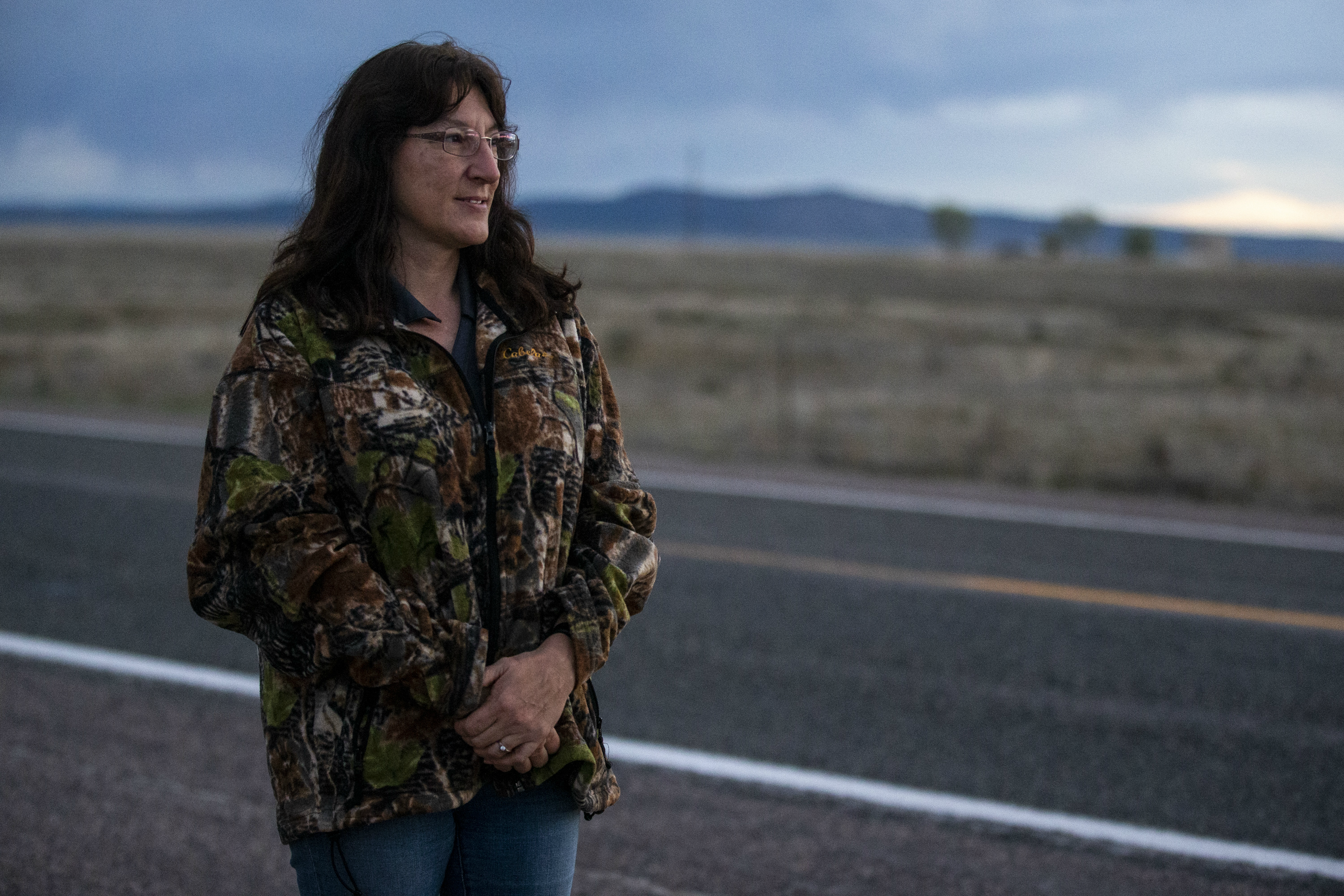 Jennifer Cordova, a wildlife specialist with the Arizona Game and Fish Department, poses for a portrait after a night of spotlighting for black-footed ferrets on April 20, 2019, near Seligman.