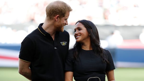 Prince Harry and Duchess Meghan at the Red...